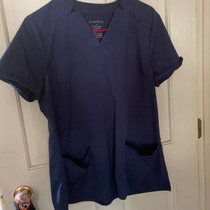 Gently worn Jaanuu Navy blue two pocket scrub top
